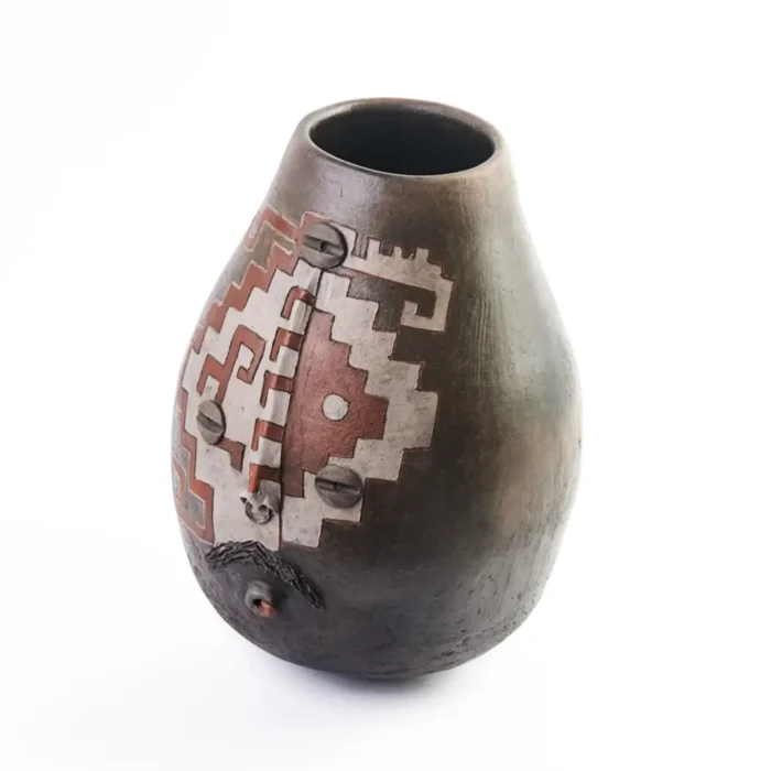 Vase with face design and grecas