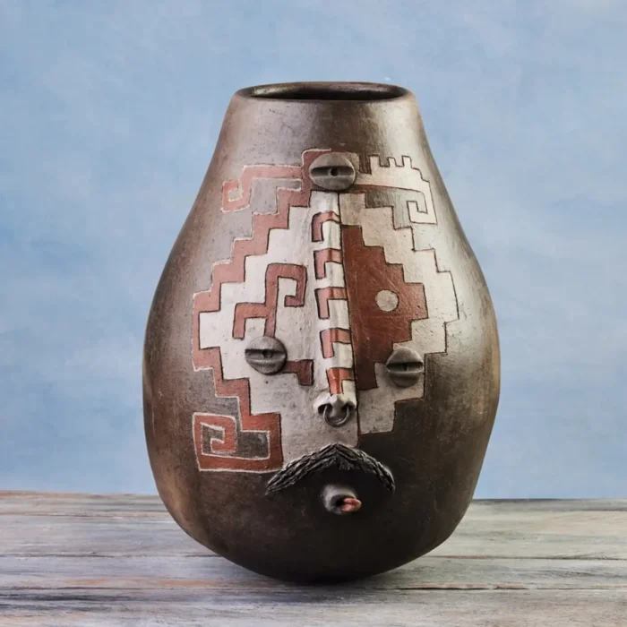 Vase with face design and grecas