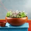 Large red clay bowl