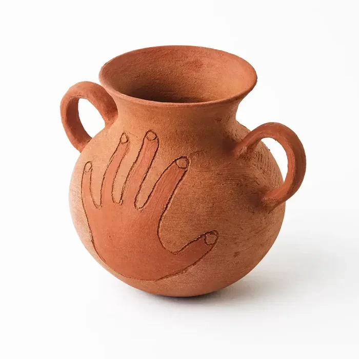 Pot with handle and hand in red clay