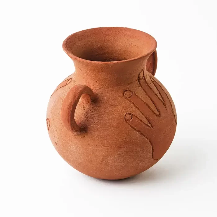 Pot with handle and hand in red clay