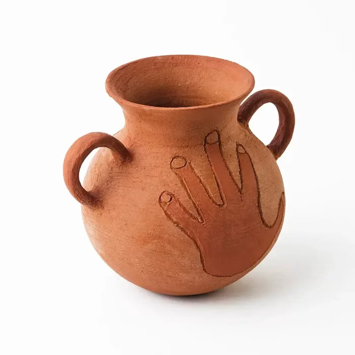 Pot with handle and hand in red clay