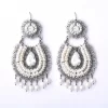 Filigree earrings in the form of white zirconia hoops