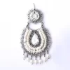 Filigree earrings in the form of white zirconia hoops