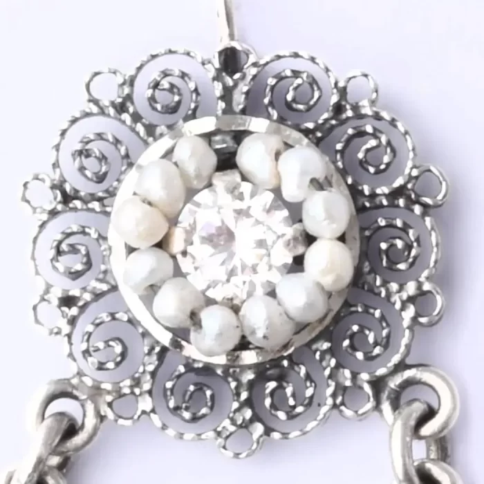 Filigree earrings in the form of white zirconia hoops