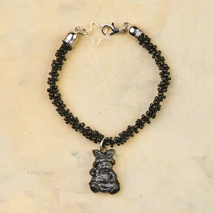 Bracelet with black mud charm. Different models.