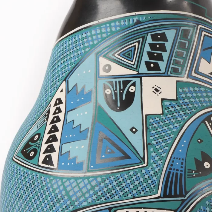 Black pot with blue fish