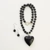 Black clay necklace with heart charm