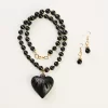 Black clay necklace with heart charm