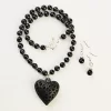 Black clay necklace with heart charm