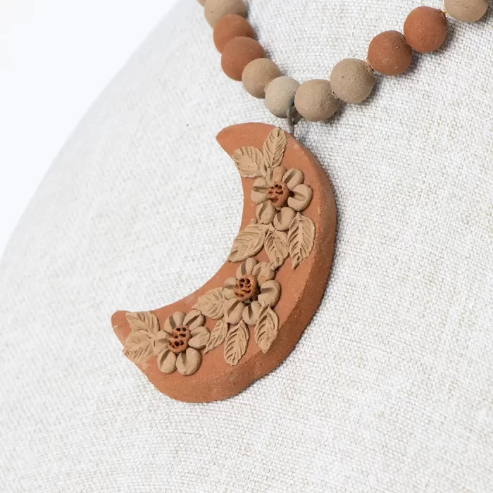Clay necklace with decorated pendant