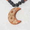 Clay necklace with decorated pendant