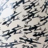 White vase with lizard design