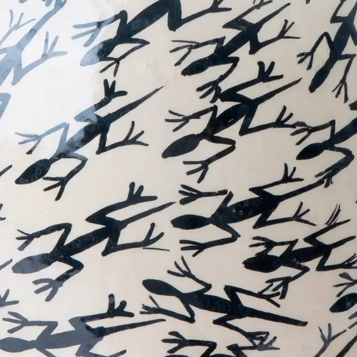 White vase with lizard design