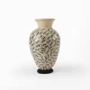 White vase with lizard design