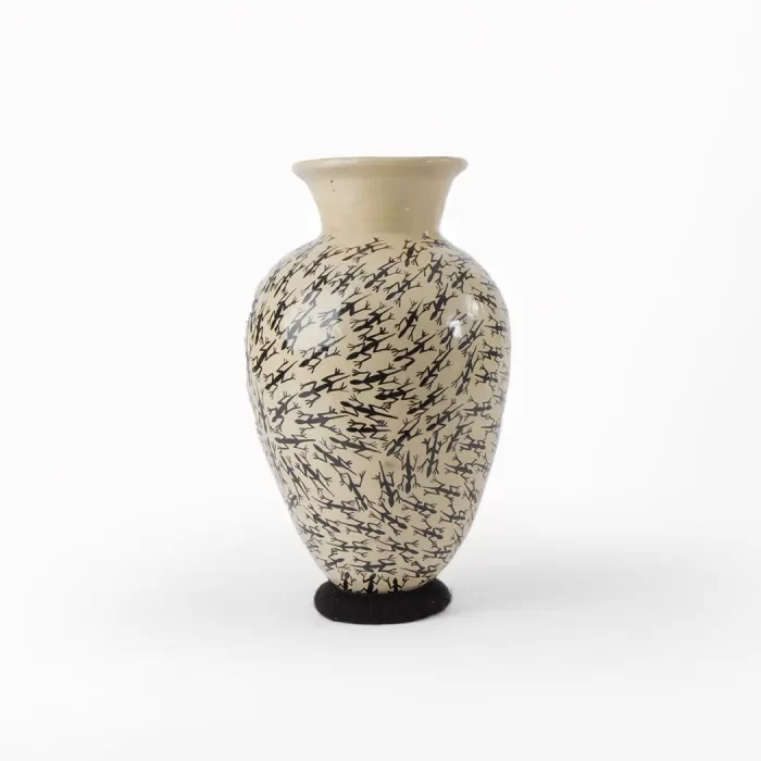 White vase with lizard design