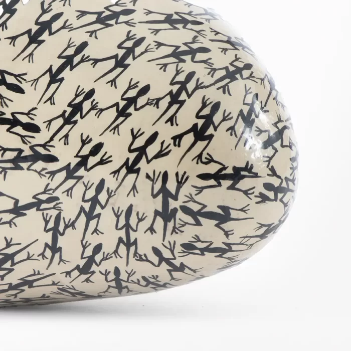 White vase with lizard design