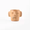 Vase with face and ears of natural clay