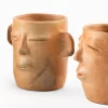 Vase with face and ears of natural clay