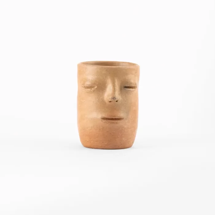 Tumbler with natural clay face