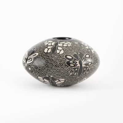 Black and white ceramic pot with different designs