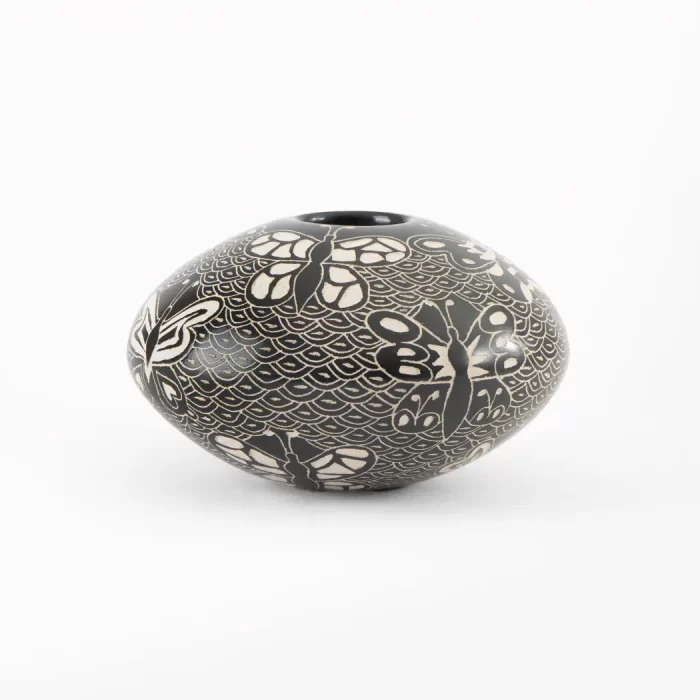 Black and white ceramic pot with different designs