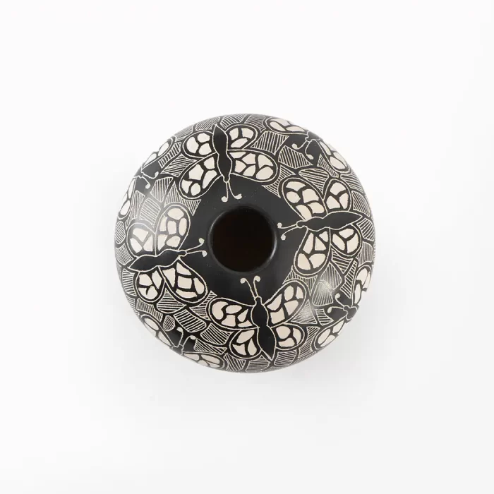 Black and white ceramic pot with different designs