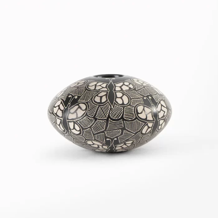 Black and white ceramic pot with different designs