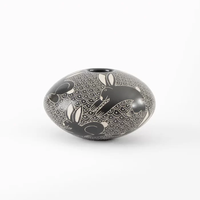 Black and white ceramic pot with different designs