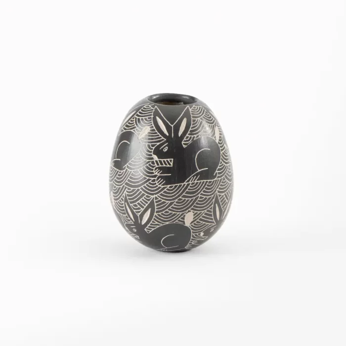 Black and white ceramic pot with elongated design