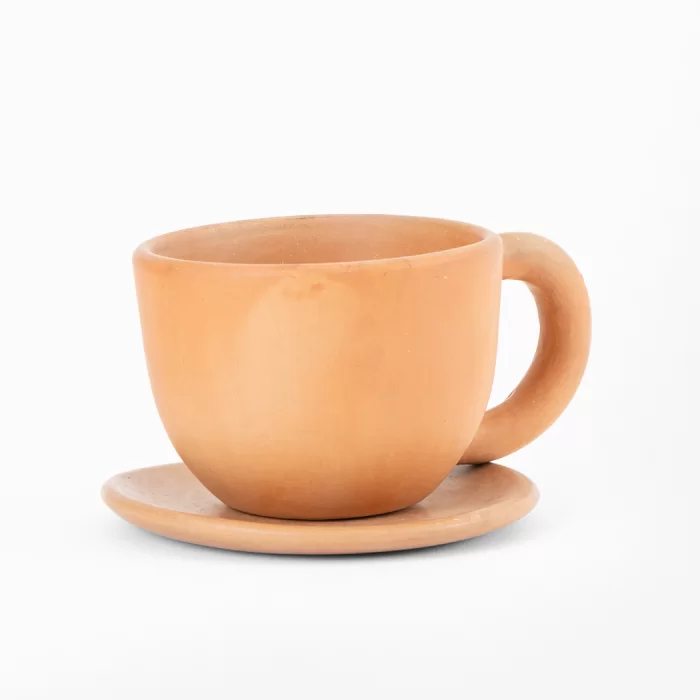 Natural terracotta colored earthenware cup and saucer