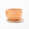 Natural terracotta colored earthenware cup and saucer