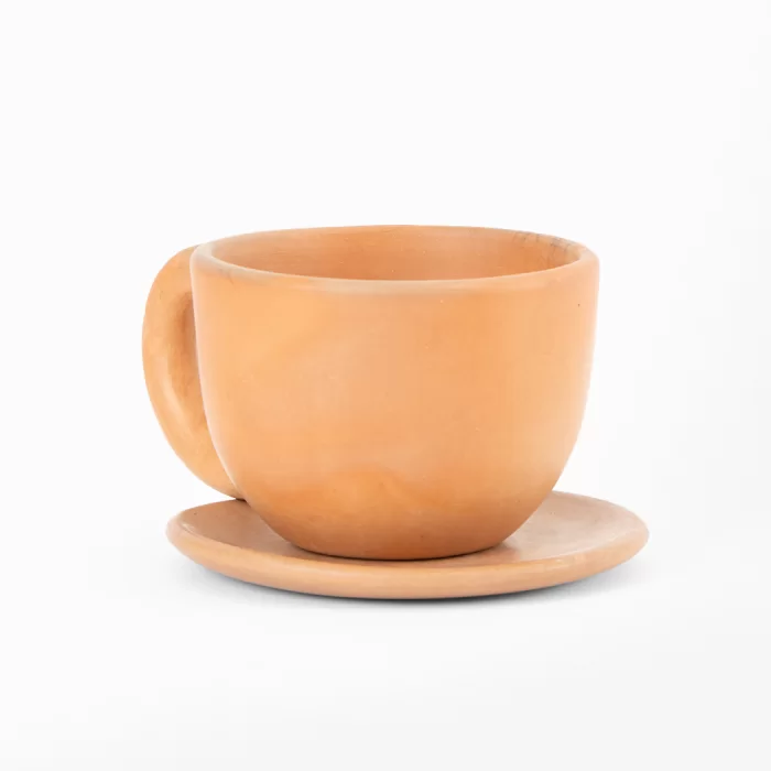 Natural terracotta colored earthenware cup and saucer