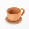 Natural terracotta colored earthenware cup and saucer
