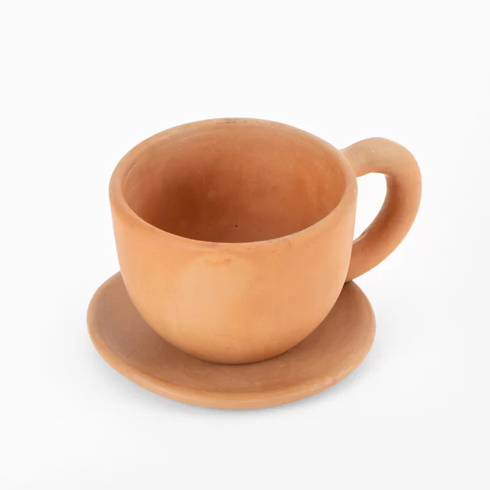 Natural terracotta colored earthenware cup and saucer