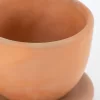 Natural terracotta colored earthenware cup and saucer