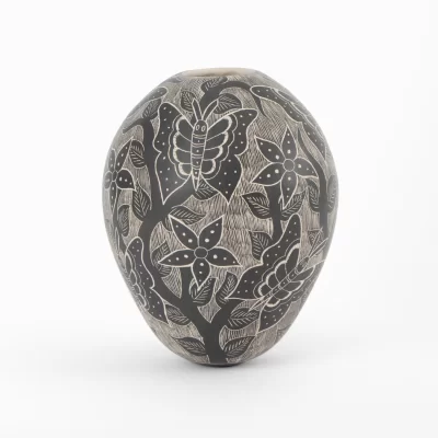 Mata Ortiz black and white ceramic pot with butterflies and flowers design.