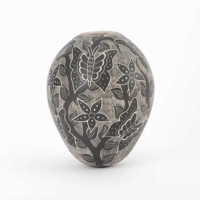 Mata Ortiz black and white ceramic pot with butterflies and flowers design.