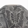 Mata Ortiz black and white ceramic pot with butterflies and flowers design.