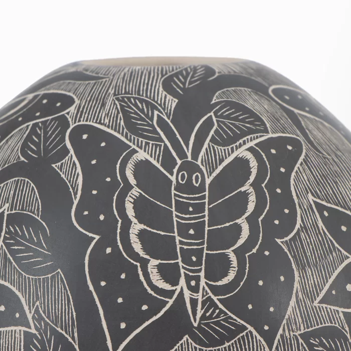Mata Ortiz black and white ceramic pot with butterflies and flowers design.