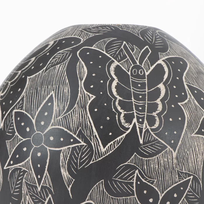 Mata Ortiz black and white ceramic pot with butterflies and flowers design.