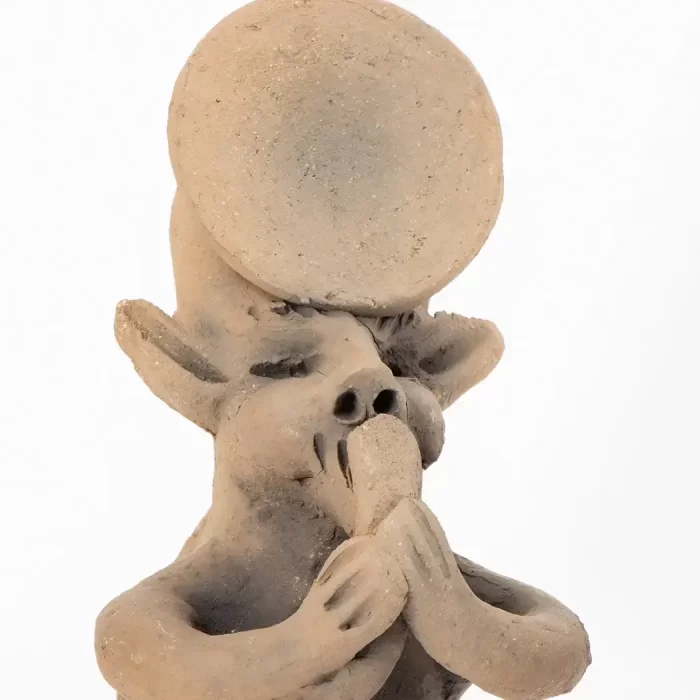 Musician nahual made of natural clay, smoked