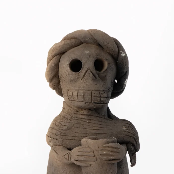 Calaca with rebozo and braid