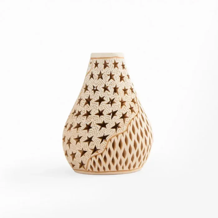 Openwork white clay bottle