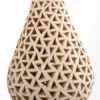 Openwork white clay bottle