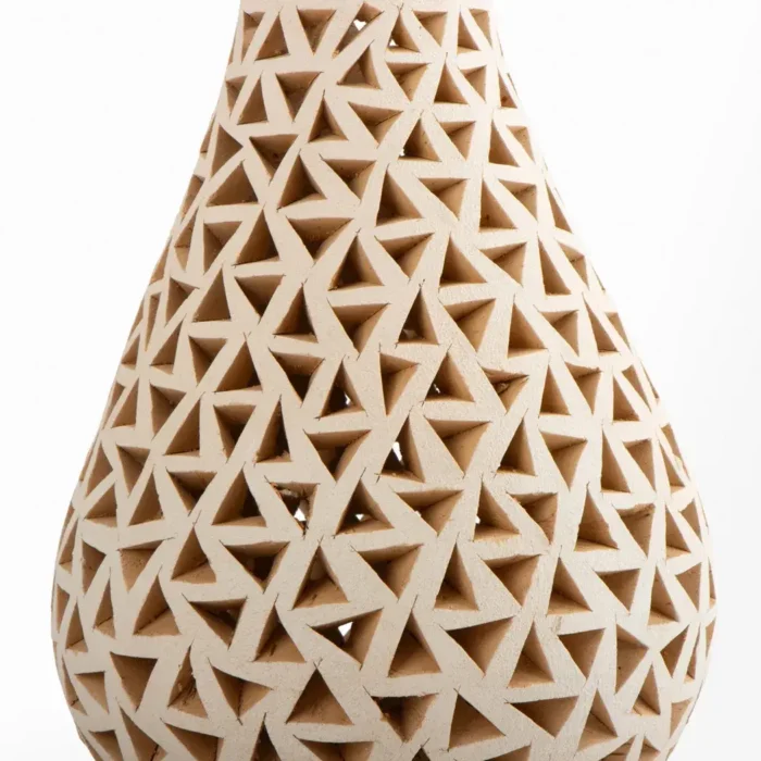 Openwork white clay bottle