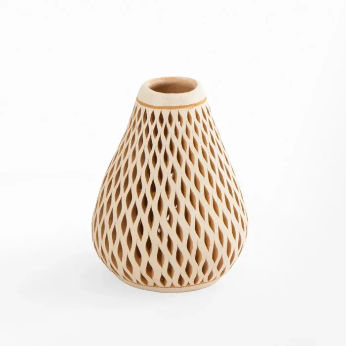 Openwork white clay bottle
