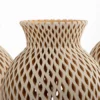 Beige openwork earthenware vase