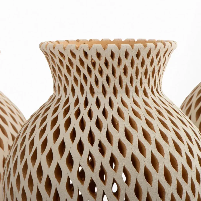 Beige openwork earthenware vase