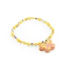 Pulsera de piedras de colores con dije de madera